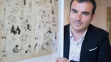 Eric Leroy, expert de la vente Tintin, 30 avril 2016 présente la double planche de l'album mythique d'Hergé, "Le Sceptre d'Ottokar" (vendue par le chanteur Renaud)  adjugée pour 1,046 million d'euros.
 ( ROMUALD MEIGNEUX/SIPA)