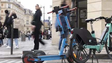 Dott scooters and a Tier bicycle on the street in Paris, April 1, 2023. (VINCENT ISORE / MAXPPP)