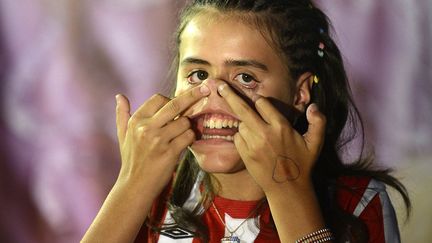 Une participante au concours de la grimace la plus horrible ("Concurso de Feos") organis&eacute; &agrave; Bilbao (Espagne), le 23 ao&ucirc;t 2012. (VINCENT WEST / REUTERS)