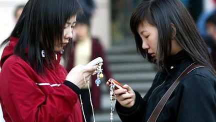 L'opérateur téléphonique China Mobile compte 17 millions de clients. (AFP PHOTO/GOH CHAI HIN)