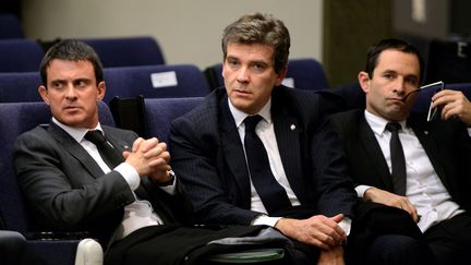 Manuel Valls, Arnaud Montebourg et Benoît Hamon, le 27 novembre 2013, lors d'une conférence de presse à Madrid, en Espagne.&nbsp; (GERARD JULIEN / AFP)