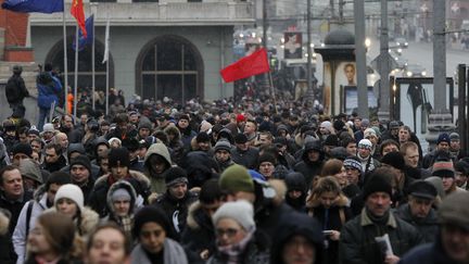 Des manifestants rallient la place Bolotnaya &agrave; Moscou (Russie), le 10 d&eacute;cembre 2011, pour protester contre les fraudes aux &eacute;lections l&eacute;gislatives. (ANTON GOLUBEV / REUTERS)