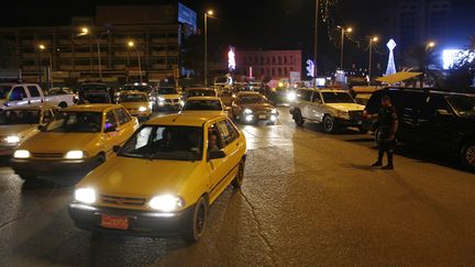 &nbsp; (Bagdad, samedi soir... © REUTERS/Thaier Al-Sudani)