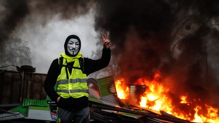 Un manifestant à Paris le 1er décembre.&nbsp; (ABDULMONAM EASSA / AFP)