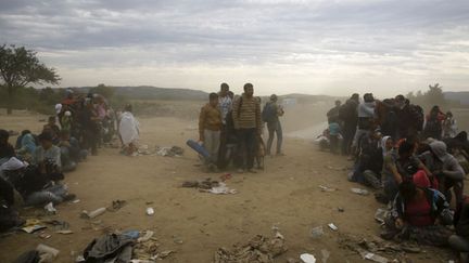 &nbsp; (Des migrants dans le village grec d'Idomeni, près de la frontière macédonienne, en septembre dernier. © REUTERS/Yannis Behrakis)