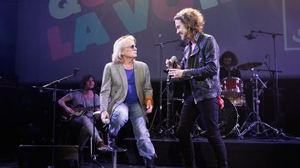 Les chanteurs Christophe et Julien Doré en décembre 2013 lors d'une soirée consacrée aux 50 ans de France Inter à la Gaîté Lyrique à Paris.&nbsp; (JULIEN HEKIMIAN / GETTY IMAGES EUROPE)