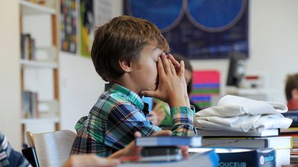 Un élève d'une école de Strasbourg, en septembre 2012. (FREDERICK FLORIN / AFP)