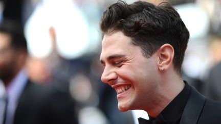 Un Xavier Dolan souriant venu présenter Matthias et Maxime (LOIC VENANCE / AFP)