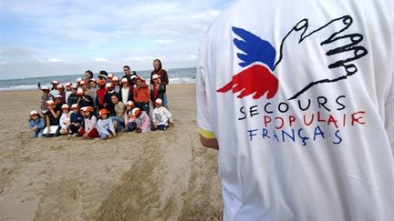 Une journée à la mer pour les "oubliés des vacances" organisée par le Secours populaire à Trouville, 22 août 2006 (© AFP/MYCHELE DANIAU)