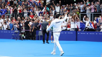 Florent Manaudou greeting the French public during the Paris Olympic Games, on August 2, 2024 at the Paris La Défense Arena, after receiving his bronze medal in the 50m freestyle. (COUVERCELLE ANTOINE / KMSP / AFP)