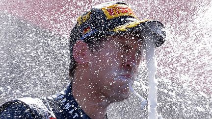 L'Allemand Sebastian Vettel sur le podium du Grand Prix d'Allemagne &agrave;&nbsp;N&uuml;rburg (Allemagne), le 7 juillet 2013. (MAXPPP)