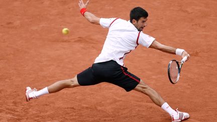 Novak Djokovic en situation délicate en défense (THOMAS SAMSON / AFP)