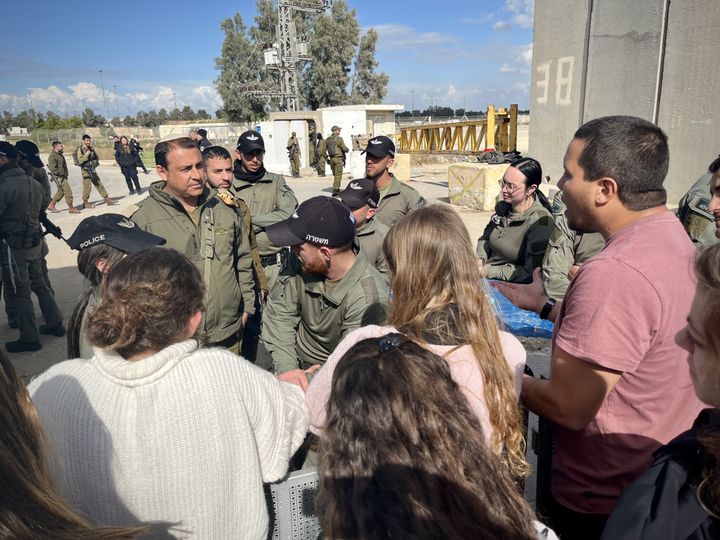 Demonstrators speak with Israeli officials at the Kerem Shalom checkpoint (Israel) on January 31, 2024.