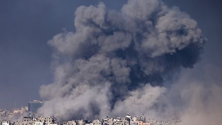 Smoke escaping from Israeli bombings on northern Gaza, December 11, 2023. (MENAHEM KAHANA / AFP)