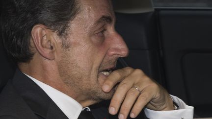 Nicolas Sarkozy quitte ses bureaux &agrave; Paris le 19 septembre 2014 (JOEL SAGET / AFP)