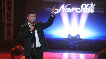 Un participant &agrave; la derni&egrave;re &eacute;dition de la "Nouvelle Star" palestinienne, en mai 2011. (MUSA AL SHAER / AFP)