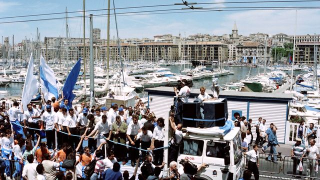 On June 1, the champions celebrate their European title on the Vieux-Port in Marseille.  The Marseille players are welcomed as heroes by the tens of thousands of supporters who have come to commune with the winners.  (BEATRICE PINOT / AFP)