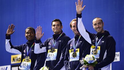 Le relais 4x100m français, champion du monde à Kazan : Medhi Metella, Florent Manaudou, Fabien Gilot et Jérémy Stravius (de gauche à droite). (MARTIN BUREAU / AFP)