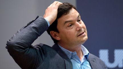 L'&eacute;conomiste fran&ccedil;ais Thomas Piketty lors d'une pr&eacute;sentation de son livre au King's College &agrave; Londres (Royaume-Uni), le 30 avril 2014. (LEON NEAL / AFP)