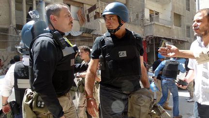 Les inspecteurs de l'ONU &agrave; leur arriv&eacute;e &agrave; Damas (Syrie), le 28 ao&ucirc;t 2013. (MOHAMED ABDULLAH / AFP)