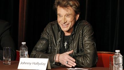 Johnny Hallyday pr&eacute;sente sa tourn&eacute;e 2012 lors d'une conf&eacute;rence &agrave; la Tour Eiffel le 3 d&eacute;cembre 2011. (BESTIMAGE / AFP)