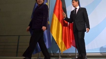 La chancelière allemande, Angela Merkel, et le président français, Nicolas Sarkozy (AFP PHOTO / JOHANNES EISELE)