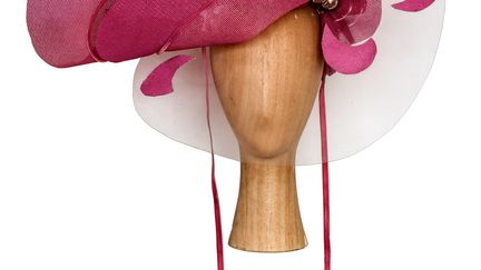 S’éloignant de la conception traditionnelle du chapeau, il se définit comme un artiste et non comme modiste. Il réinvente des modèles traditionnels, façonne des formes sobres mais audacieuses, voire d’une excentricité contrôlée. Ses chapeaux ont connu la gloire sur les champs de courses d’Ascot ou dans les mariages huppés. Son but est de « créer » la mode et non « l’art de la mode ». Pour lui, cliente et créateur participent ensemble à la vie de cet art de l’éphémère par une initiation réciproque indispensable. Il insiste sur le regard qui contribue au dialogue instauré entre la cliente et le modiste.
 (Atelier-Musée du Chapeau)