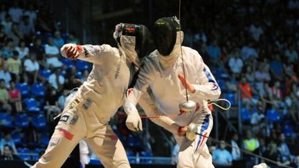 La Française  Alexandre Blaszyck (à droite) face à la Polonaise  Radoslaw Zawrotniak (à gauche)