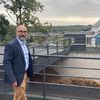 Jean-Marc Labbé, maire de La Méaugon (Côtes-d'Armor) devant la chaudière bois de la commune.&nbsp; (MATHILDE GRACIA/ FRANCEINFO)