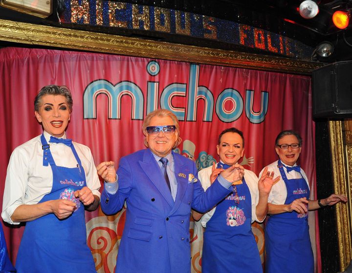 Michou and the artists of his transformist troupe on the stage of his cabaret in January 2010. (BENAROCH / SIPA)