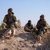 Des rebelles syriens sur l'aérodrome militaire de Kweyris, dans l'est de la province d'Alep, le 3 décembre 2024. (RAMI AL SAYED / AFP)