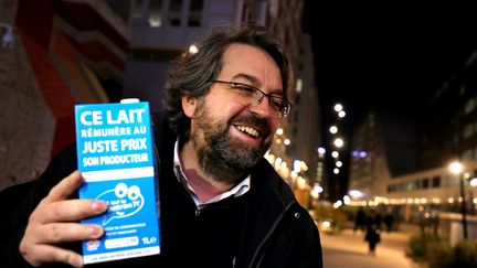 Nicolas Chabanne, co-founder of the brand "Who is the boss?", with its flagship product: the blue and white milk carton.  (Nicolas Vallauri / MAXPPP)