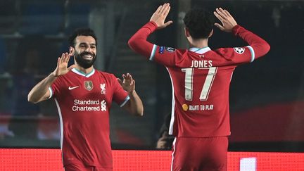 Mohamed Salah fête son but, le 21e avec Liverpool en Ligue des Champions. (MIGUEL MEDINA / AFP)