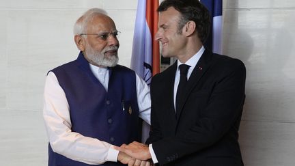 Indian Prime Minister Narendra Modi and French President Emmanuel Macron during a meeting on the sidelines of the G20 Leaders' Summit in Bali, Indonesia, November 16, 2022. (ACHMAD IBRAHIM/POOL/AP POOL)