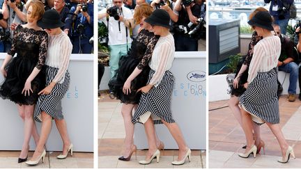 Pas question pour Emma Stone et Parker Posey d'avoir un accident vestimentaire : face aux vents, les deux actrices se sont entraid&eacute;es avec le sourire. (YVES HERMAN / REUTERS / X00380)