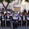 Des femmes druzes assistent aux funérailles des 12 enfants tués par une frappe sur le village de Majdal Shams, dans le Golan occupé, le 29 juillet 2024. (JALAA MAREY / AFP)