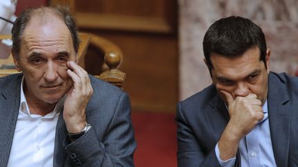 &nbsp; (Le Premier ministre grec et son ministre des finances aprés le vote du parlement © reuters/Christian Hartmann)