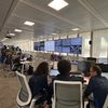 Dans le centre opérationnel des Jeux de Paris 2024, où des centaines de données en temps réel sont projetées sur un mur d'une douzaine d'écrans. (CLARA LECOCQ-REALE / RADIO FRANCE)