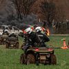 Un gendarme mobile anti-émeutes, circulant en quad, tire avec un LBD sur les manifestants lors de la manifestation contre les "méga-bassines" à Sainte-Soline (Deux-Sèvres), le 25 mars 2023. (THIBAUD MORITZ / AFP)