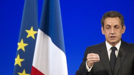 Nicolas Sarkozy en discours lors de son meeting de campagne à Paris le 31 mars (LIONEL BONAVENTURE / AFP)