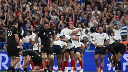 The joy of the French and their fans who inflicted on the All Blacks their first defeat in their history in the group stage of the World Cup.  (Martin's office/AFP)