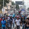 Des manifestants défilent contre le président Jovenel Moïse, dans les rues de la capitale, Port-au-Prince, le 18 novembre 2019.&nbsp; (VALERIE BAERISWYL / AFP)