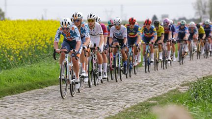 The Paris-Roubaix women's peloton on the first paved sector of the race, in Hornaing, April 6, 2024. (THOMAS SAMSON / AFP)