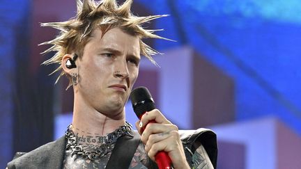 How many pots of setting gel were needed to achieve this explosive hairstyle?  Singer Machine Gun Kelly on stage at Hellfest Friday June 16, 2023. (JEROME FOUQUET / MAXPPP)