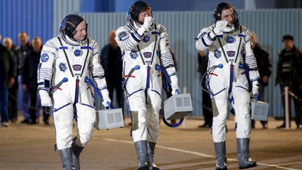 &nbsp; (L'astronaute américain Scott Kelly et les cosmonautes russes Mikhail Kornienko et Gennady Padalka, en route pour l'ISS © REUTERS/Maxim Zmeyev)