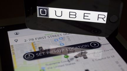 L'application Uber utilisée depuis une tablette, le 5 mars 2014, à Washington (Etats-Unis).&nbsp; (BLOOMBERG / BLOOMBERG / GETTY IMAGES)