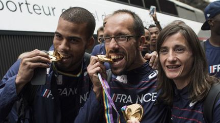 Benjamin Compaoré, Yohann Diniz et Christelle Daunay (FRED DUFOUR / AFP)