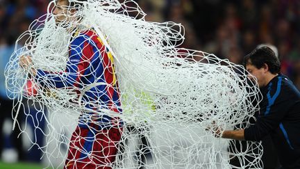 Le joueur du Bar&ccedil;a G&eacute;rard Piqu&eacute; apr&egrave;s la victoire en Ligue des Champions, le 28 mai 2011 &agrave; Wembley (Londres). (LLUIS GENE / AFP)