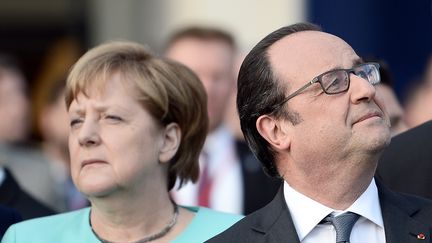 Angela Merkel et François Hollande au sommet de l'OTAN à Varsovie en Pologne le 8 juillet 2016 (STEPHANE DE SAKUTIN / AFP)