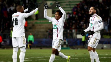 Malick Fofana, Ryan Cherki et Alexandre Lacazette, le vendredi 19 janvier 2024 à Limoges. (ROMAIN PERROCHEAU / AFP)